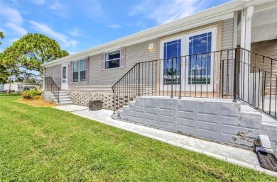 Welcome to 5748 Holiday Park Blvd.  This home is located in the on Sabal Trace Golf and Country Club in Florida - for sale on GolfHomes.com, golf home, golf lot
