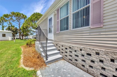 Welcome to 5748 Holiday Park Blvd.  This home is located in the on Sabal Trace Golf and Country Club in Florida - for sale on GolfHomes.com, golf home, golf lot