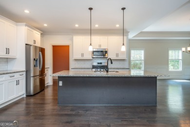 Peaceful living meets modern comfort in this stunning Canton on The Fairways at Laurel Canyon in Georgia - for sale on GolfHomes.com, golf home, golf lot