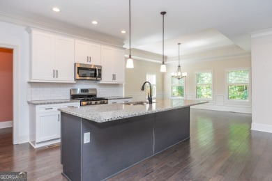 Peaceful living meets modern comfort in this stunning Canton on The Fairways at Laurel Canyon in Georgia - for sale on GolfHomes.com, golf home, golf lot