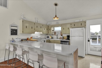 Welcome to 25 Newport Street, a breathtaking coastal retreat on Sea Trail Golf Resort in North Carolina - for sale on GolfHomes.com, golf home, golf lot