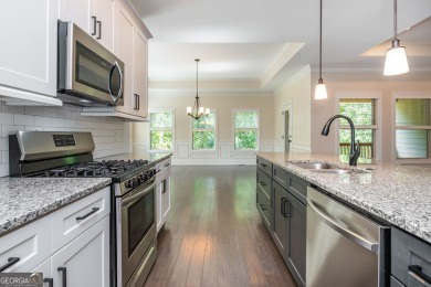 Peaceful living meets modern comfort in this stunning Canton on The Fairways at Laurel Canyon in Georgia - for sale on GolfHomes.com, golf home, golf lot