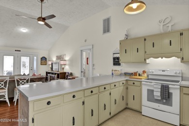 Welcome to 25 Newport Street, a breathtaking coastal retreat on Sea Trail Golf Resort in North Carolina - for sale on GolfHomes.com, golf home, golf lot