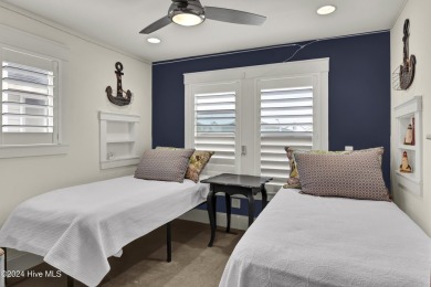 Welcome to 25 Newport Street, a breathtaking coastal retreat on Sea Trail Golf Resort in North Carolina - for sale on GolfHomes.com, golf home, golf lot