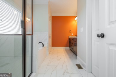 Peaceful living meets modern comfort in this stunning Canton on The Fairways at Laurel Canyon in Georgia - for sale on GolfHomes.com, golf home, golf lot