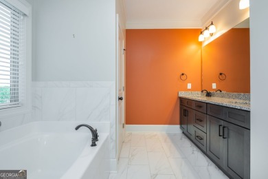 Peaceful living meets modern comfort in this stunning Canton on The Fairways at Laurel Canyon in Georgia - for sale on GolfHomes.com, golf home, golf lot