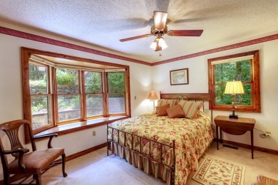 You will love coming home to this attractive and comfortable on Sapphire National Golf Club in North Carolina - for sale on GolfHomes.com, golf home, golf lot
