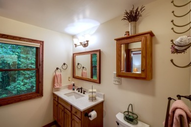 You will love coming home to this attractive and comfortable on Sapphire National Golf Club in North Carolina - for sale on GolfHomes.com, golf home, golf lot