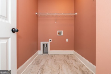 Peaceful living meets modern comfort in this stunning Canton on The Fairways at Laurel Canyon in Georgia - for sale on GolfHomes.com, golf home, golf lot