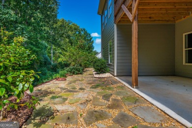 Peaceful living meets modern comfort in this stunning Canton on The Fairways at Laurel Canyon in Georgia - for sale on GolfHomes.com, golf home, golf lot
