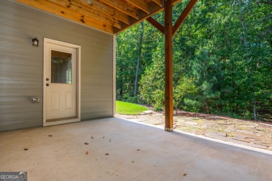 Peaceful living meets modern comfort in this stunning Canton on The Fairways at Laurel Canyon in Georgia - for sale on GolfHomes.com, golf home, golf lot