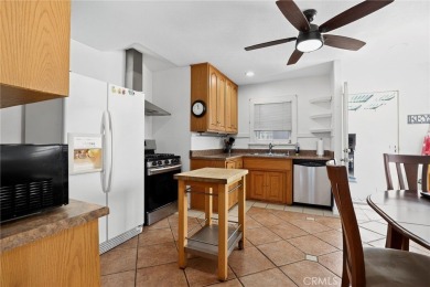 Discover this Spanish-style fixer located on a desirable corner on Mile Square Golf Course in California - for sale on GolfHomes.com, golf home, golf lot