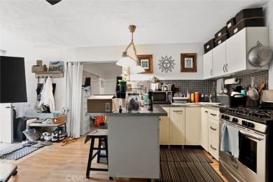 Discover this Spanish-style fixer located on a desirable corner on Mile Square Golf Course in California - for sale on GolfHomes.com, golf home, golf lot