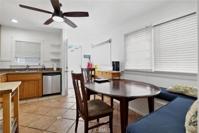 Discover this Spanish-style fixer located on a desirable corner on Mile Square Golf Course in California - for sale on GolfHomes.com, golf home, golf lot