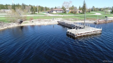 Escape to your own waterfront paradise along the idyllic shores on Garden Golf Course in Michigan - for sale on GolfHomes.com, golf home, golf lot