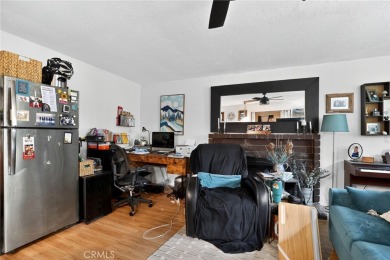 Discover this Spanish-style fixer located on a desirable corner on Mile Square Golf Course in California - for sale on GolfHomes.com, golf home, golf lot