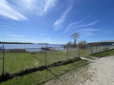 Escape to your own waterfront paradise along the idyllic shores on Garden Golf Course in Michigan - for sale on GolfHomes.com, golf home, golf lot