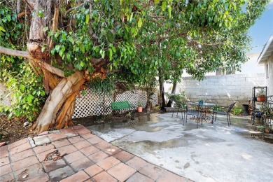Discover this Spanish-style fixer located on a desirable corner on Mile Square Golf Course in California - for sale on GolfHomes.com, golf home, golf lot