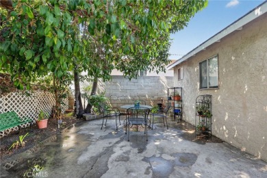 Discover this Spanish-style fixer located on a desirable corner on Mile Square Golf Course in California - for sale on GolfHomes.com, golf home, golf lot