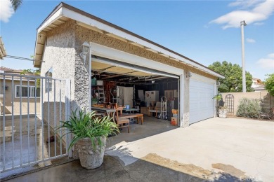 Discover this Spanish-style fixer located on a desirable corner on Mile Square Golf Course in California - for sale on GolfHomes.com, golf home, golf lot