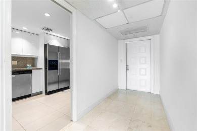 Move-in ready condo in the heart of Palm Aire featuring two en on Palm-Aire Country Club and Resort - The Oaks in Florida - for sale on GolfHomes.com, golf home, golf lot