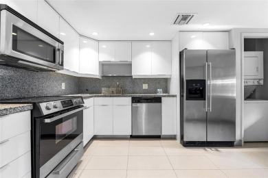 Move-in ready condo in the heart of Palm Aire featuring two en on Palm-Aire Country Club and Resort - The Oaks in Florida - for sale on GolfHomes.com, golf home, golf lot