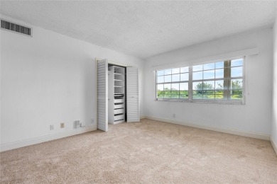 Move-in ready condo in the heart of Palm Aire featuring two en on Palm-Aire Country Club and Resort - The Oaks in Florida - for sale on GolfHomes.com, golf home, golf lot