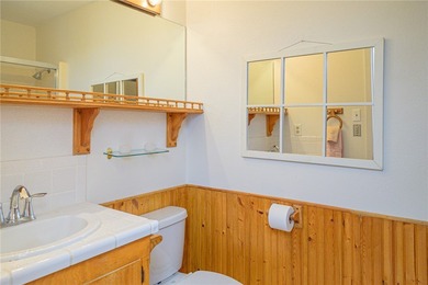 Coastal charm with Aransas Bay views in the heart of Rockport! on Rockport Country Club in Texas - for sale on GolfHomes.com, golf home, golf lot