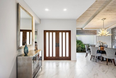 Welcome to this stunning, fully renovated contemporary residence on Bocaire Country Club in Florida - for sale on GolfHomes.com, golf home, golf lot