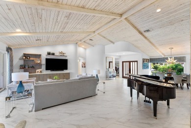 Welcome to this stunning, fully renovated contemporary residence on Bocaire Country Club in Florida - for sale on GolfHomes.com, golf home, golf lot
