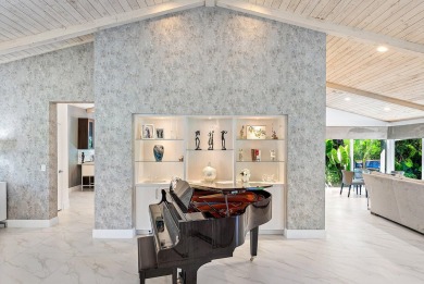 Welcome to this stunning, fully renovated contemporary residence on Bocaire Country Club in Florida - for sale on GolfHomes.com, golf home, golf lot