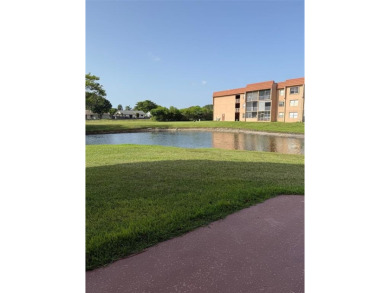 Charming Corner Garden-Style Condo Located on the first floor in on Sunrise Lakes Phase III in Florida - for sale on GolfHomes.com, golf home, golf lot