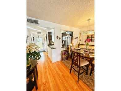 Charming Corner Garden-Style Condo Located on the first floor in on Sunrise Lakes Phase III in Florida - for sale on GolfHomes.com, golf home, golf lot