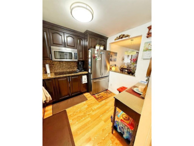 Charming Corner Garden-Style Condo Located on the first floor in on Sunrise Lakes Phase III in Florida - for sale on GolfHomes.com, golf home, golf lot
