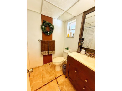 Charming Corner Garden-Style Condo Located on the first floor in on Sunrise Lakes Phase III in Florida - for sale on GolfHomes.com, golf home, golf lot