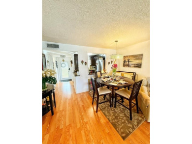 Charming Corner Garden-Style Condo Located on the first floor in on Sunrise Lakes Phase III in Florida - for sale on GolfHomes.com, golf home, golf lot