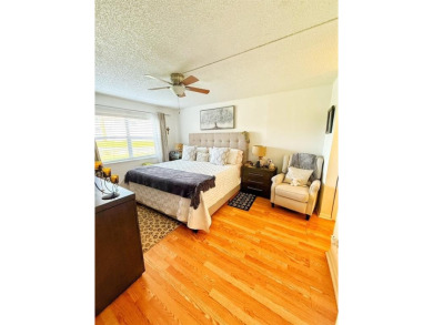 Charming Corner Garden-Style Condo Located on the first floor in on Sunrise Lakes Phase III in Florida - for sale on GolfHomes.com, golf home, golf lot