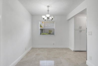 Beautifully updated first-floor unit in the sought-after Kings on Kings Point Golf - Executive in Florida - for sale on GolfHomes.com, golf home, golf lot