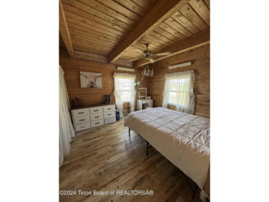 Quaint log cabin living at the base of the Bridger-Teton on Cedar Creek Golf Course in Wyoming - for sale on GolfHomes.com, golf home, golf lot