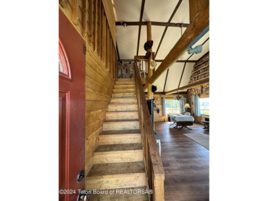 Quaint log cabin living at the base of the Bridger-Teton on Cedar Creek Golf Course in Wyoming - for sale on GolfHomes.com, golf home, golf lot