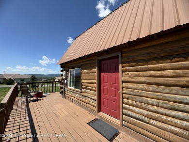 Quaint log cabin living at the base of the Bridger-Teton on Cedar Creek Golf Course in Wyoming - for sale on GolfHomes.com, golf home, golf lot