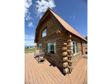 Quaint log cabin living at the base of the Bridger-Teton on Cedar Creek Golf Course in Wyoming - for sale on GolfHomes.com, golf home, golf lot