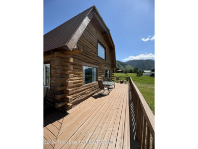 Quaint log cabin living at the base of the Bridger-Teton on Cedar Creek Golf Course in Wyoming - for sale on GolfHomes.com, golf home, golf lot