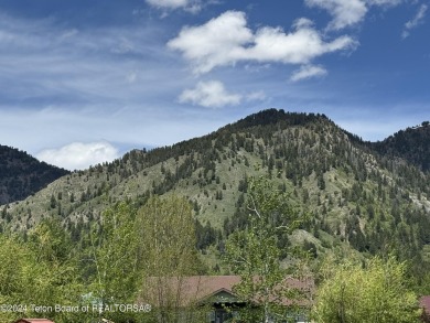 Quaint log cabin living at the base of the Bridger-Teton on Cedar Creek Golf Course in Wyoming - for sale on GolfHomes.com, golf home, golf lot