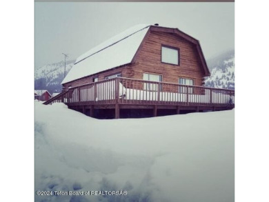 Quaint log cabin living at the base of the Bridger-Teton on Cedar Creek Golf Course in Wyoming - for sale on GolfHomes.com, golf home, golf lot