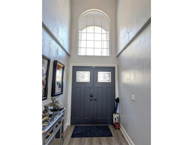 Enjoy this Beautiful two-story pool home, in the private and on The Grand Club - Pine Lakes Course in Florida - for sale on GolfHomes.com, golf home, golf lot
