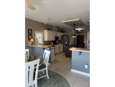 Enjoy resort-style living in this beautifully maintained on The Riverside Golf Club in Florida - for sale on GolfHomes.com, golf home, golf lot