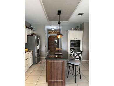 Enjoy resort-style living in this beautifully maintained on The Riverside Golf Club in Florida - for sale on GolfHomes.com, golf home, golf lot