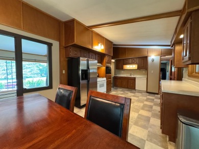 Located in the BRINKLAND neighborhood, this 3BD/2.5BA ranch home on Minocqua Country Club in Wisconsin - for sale on GolfHomes.com, golf home, golf lot