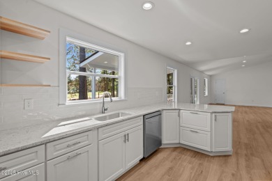 Welcome to this beautifully renovated 3-bedroom, 2-bath home in on Seven Lakes Country Club in North Carolina - for sale on GolfHomes.com, golf home, golf lot